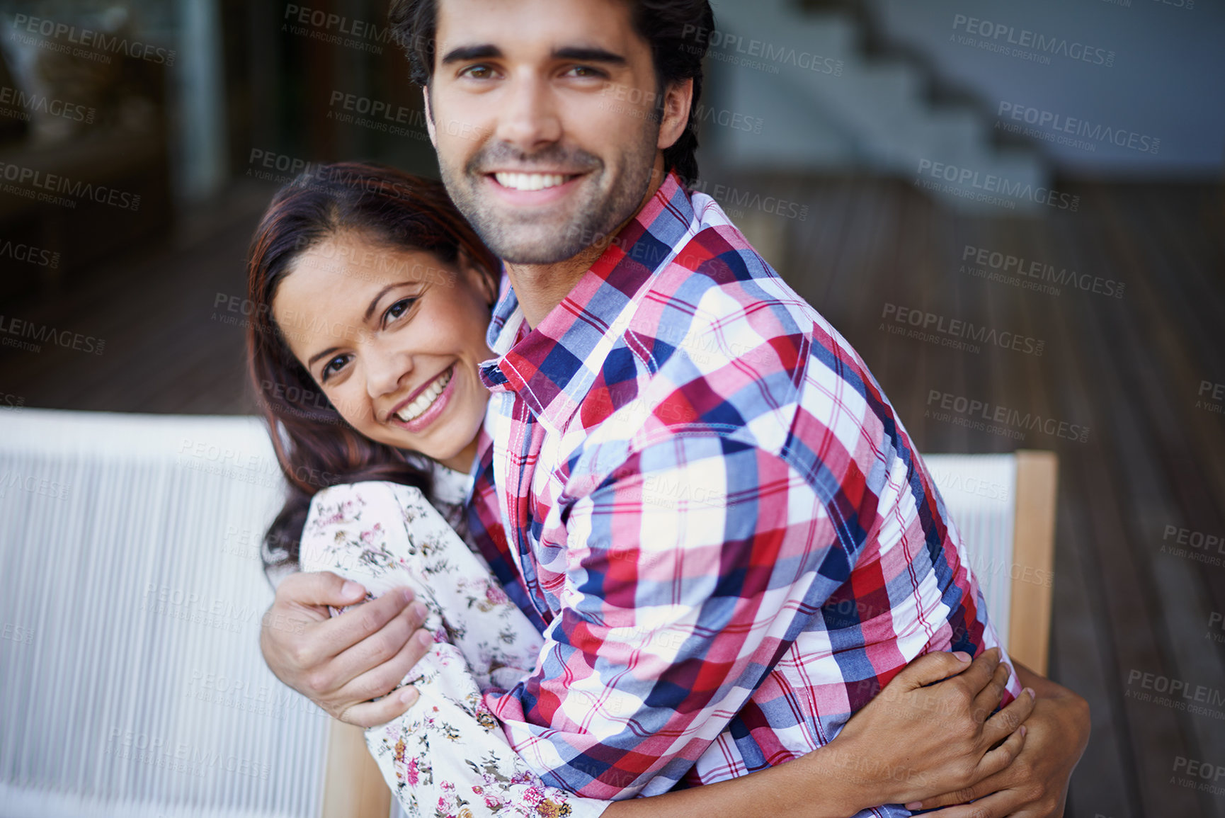 Buy stock photo Couple, people and happy with hug in home for bonding, love and support on break together. Home, relationship and romance with smile or laugh for fun, play and care as soulmate on portrait with trust