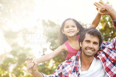 Buy stock photo Adorable girl and father playing and pretending to fly like an aeroplane. Single parent carrying his daughter on piggyback outside. Child having fun, bonding with dad in garden with bokeh copy space