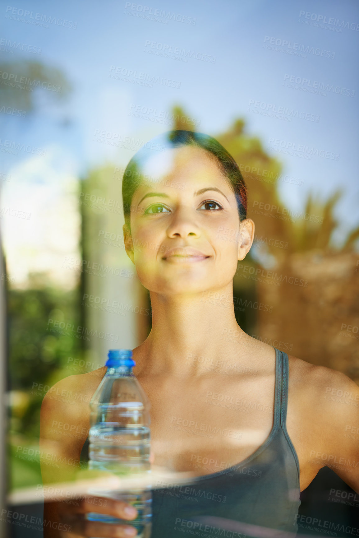 Buy stock photo Happy woman, thinking and window with water bottle for fitness, hydration or natural sustainability at home. Female person, athlete or yogi with smile for mineral liquid or reflection after exercise