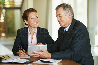 Buy stock photo Mature, businesspeople and tablet at desk with smile for ceo or manager of corporate company with pride. Technology, notes and paper with documents for accounting firm in Germany with client meeting.