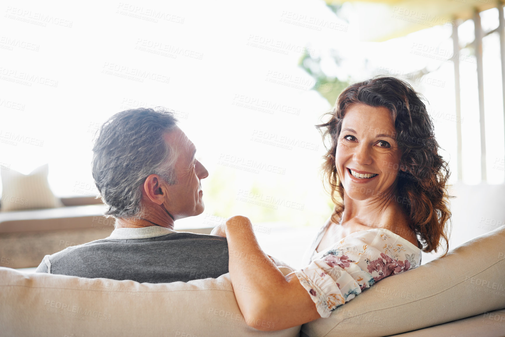 Buy stock photo Portrait, happy woman and couple on sofa in home together for love, connection or relax in living room. Face, man and smile of mature partner in lounge for care, commitment and healthy relationship