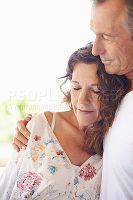 Buy stock photo Couple, home and mature people with hug for love, support and together for comfort. Relationship, commitment and bonding for romance with soulmate, care and affection for wellness and wellbeing