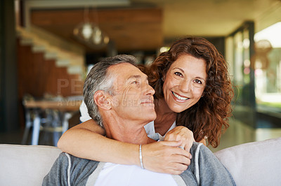 Buy stock photo Portrait, mature and happy couple hug in home living room for love, connection or trust for partnership together. Face, man and embrace woman for care, commitment and relationship for support on sofa