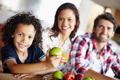 Buy stock photo A happy family enjoying a meal time together