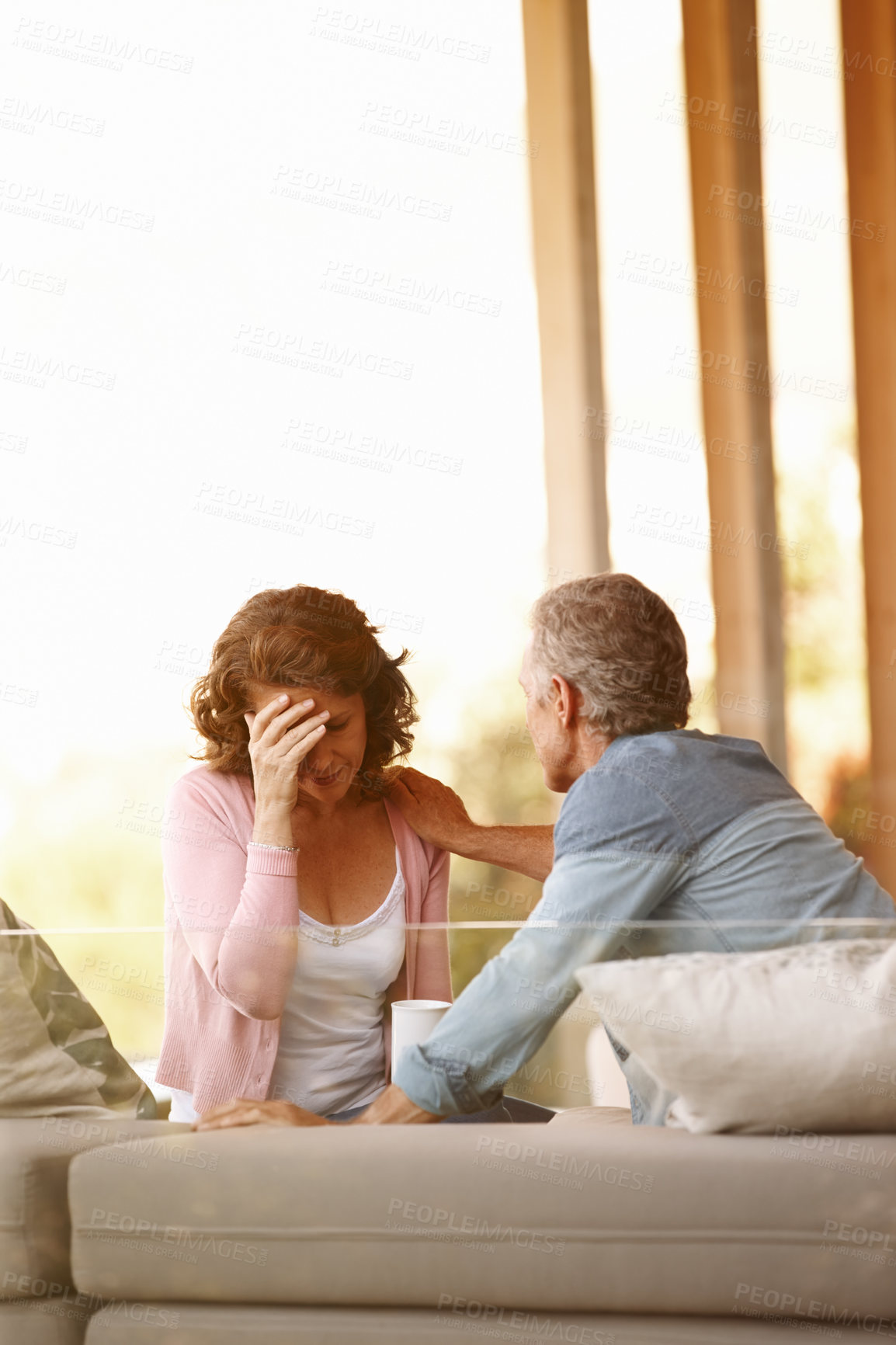 Buy stock photo Depression, mature woman and man on couch with empathy for mental health, relationship care and anxiety. Senior couple, sad and sofa in living room for grief pain, mourning together and love support