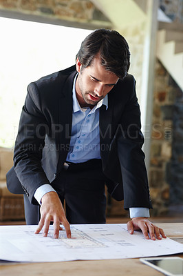 Buy stock photo Home office, planning and business man with blueprint for industrial construction, floor plan and paper. Pride, serious and male architect with thinking, project design and work for architecture firm