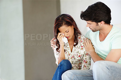 Buy stock photo Couple, crying and woman with man for support, comfort and depressed in home on stairs. Infertility, unhappy and mental health in apartment together with fear, stress and frustration on steps