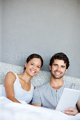 Buy stock photo Happy couple, portrait and relax with tablet on bed for online streaming,subscription or connectivity at home. Man and woman with smile on technology for show, movie or browsing in bedroom at house