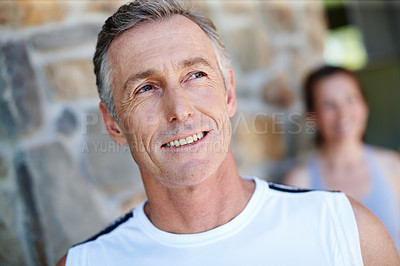 Buy stock photo Mature man, outdoor and thinking for fitness with health, happiness and wellness inspiration for training. Male runner, smile and outside wall with thoughts or ideas for exercise and running workout