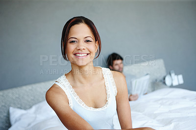 Buy stock photo Portrait, woman and smile in bed with confidence, weekend relax and couple in morning for rest in home. Happy, face or girl in bedroom for marriage, pride or comfort in hotel room, house or apartment