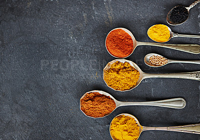 Buy stock photo Cropped shot of spoons filled with a variety of spices