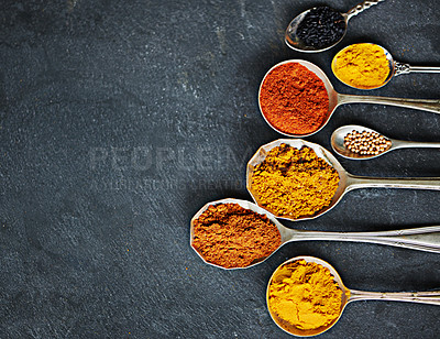 Buy stock photo Spoon, powder and group of spices by dark background for cooking dinner, health and nutrition. Turmeric, chilli and seeds on black surface with zoom for Oriental food, antioxidant and spicy cuisine