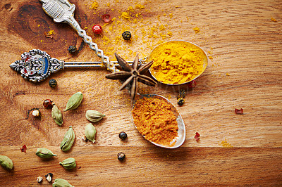 Buy stock photo Spoons, spice and selection of seasoning for cooking on kitchen table, turmeric and cardamom for meal. Top view, condiments and options for spicy gourmet in Indian culture, art and food preparation