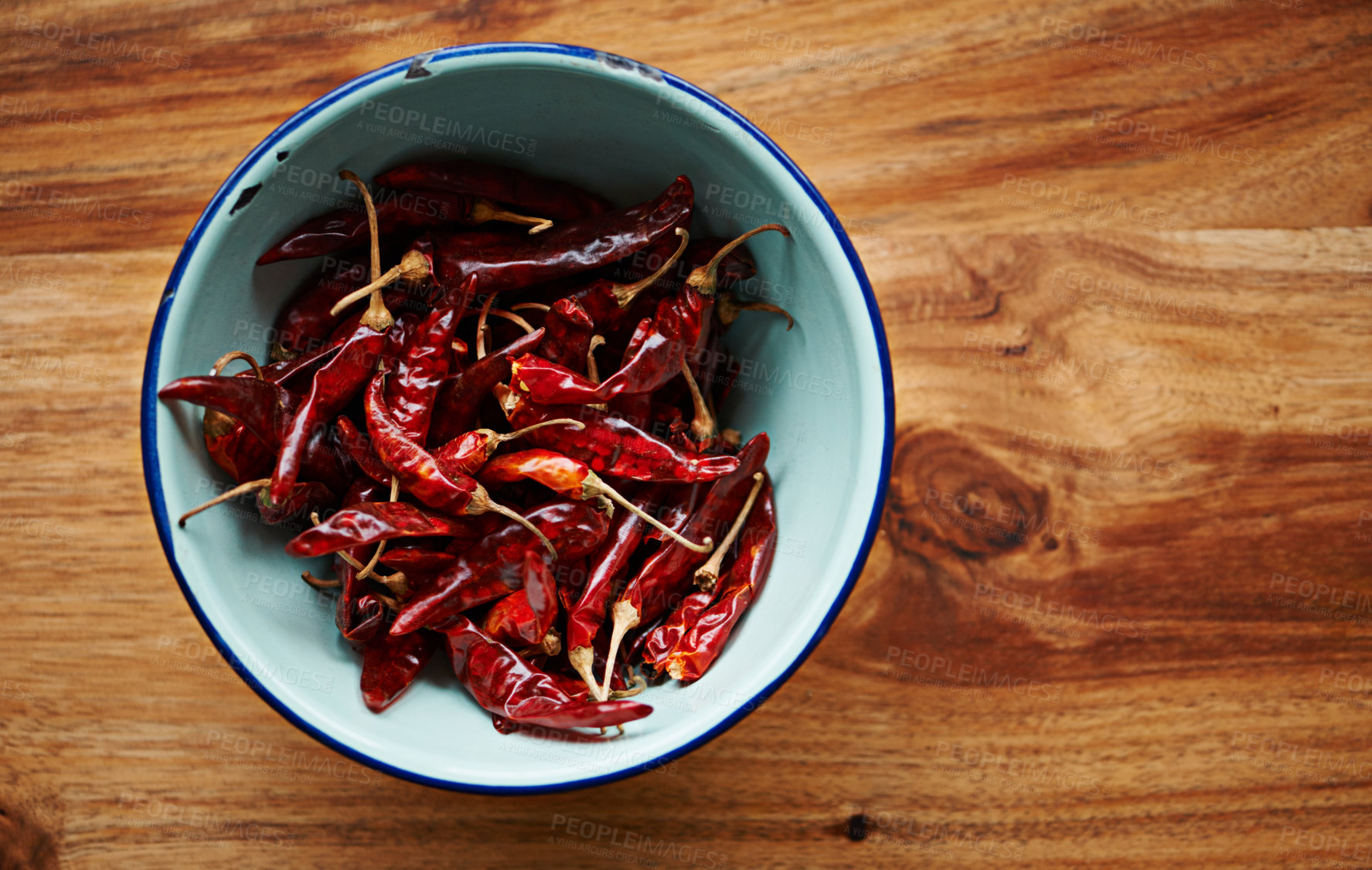 Buy stock photo Above, chilli and bowl for pepper, spices and flavor for dry ingredient for cooking, cuisine and food. Paprika, cayenne or condiment and spicy and red  for capsicum and heat in dish on mockup
