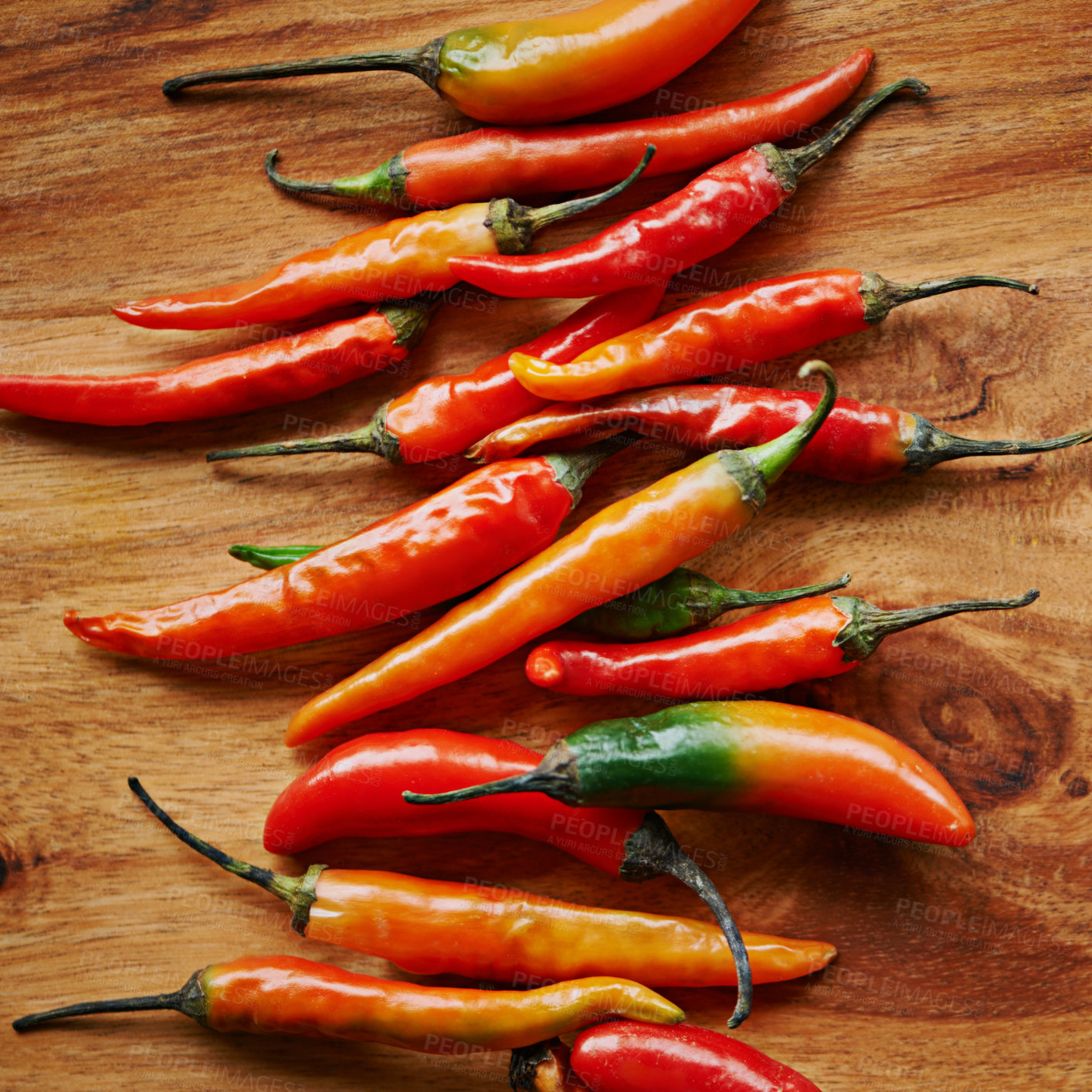 Buy stock photo Above, chilli and kitchen counter for heat, spices and flavor for dry ingredient in cooking, cuisine and food. Paprika, cayenne or condiment or spicy with red for pepper and capsicum in dish or meal