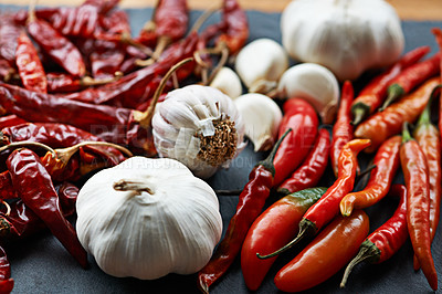 Buy stock photo Chilli, pepper and closeup of vegetables for food, ingredient or spices for nutrition and culinary flavor on table. Seasoning, heat and organic produce at home, fresh for cuisine and catering