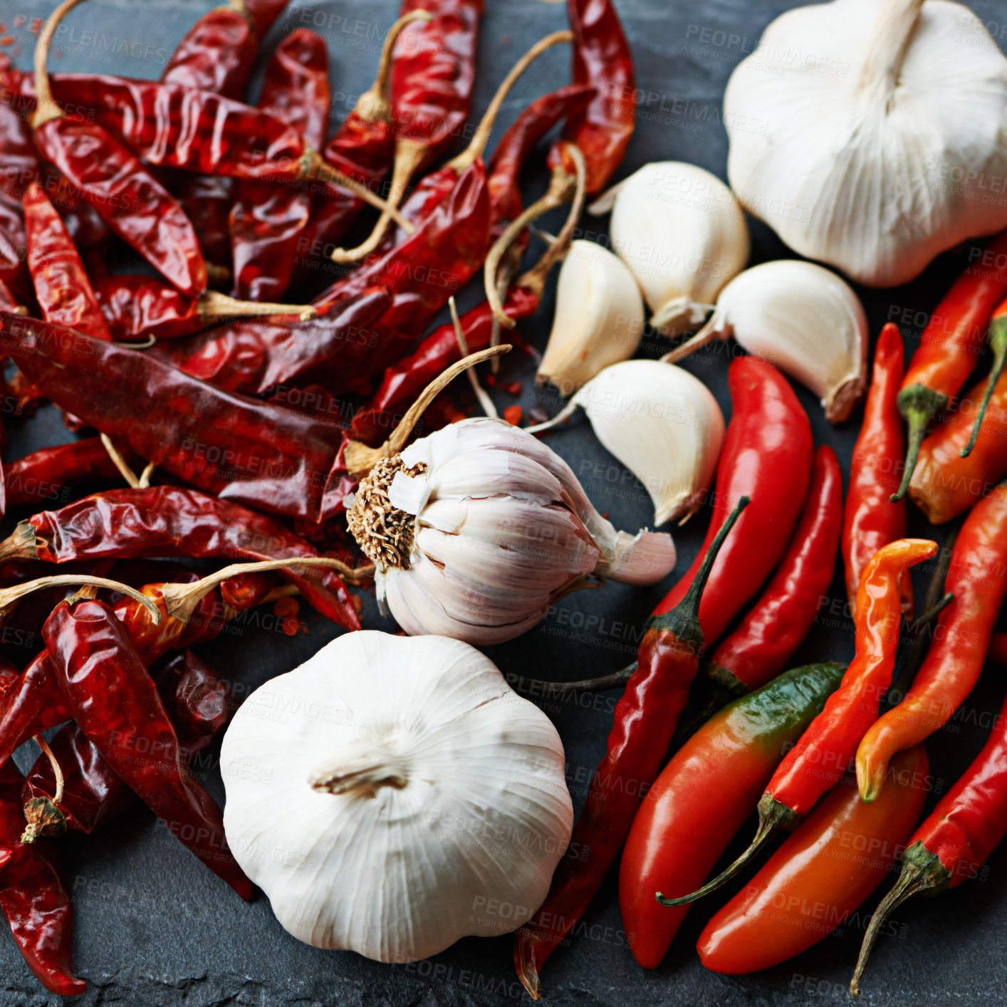 Buy stock photo Chilli, pepper and garlic, ingredients for food and closeup of culinary spices with nutrition and flavor on kitchen counter. Seasoning, heat and organic produce, fresh for cuisine and catering