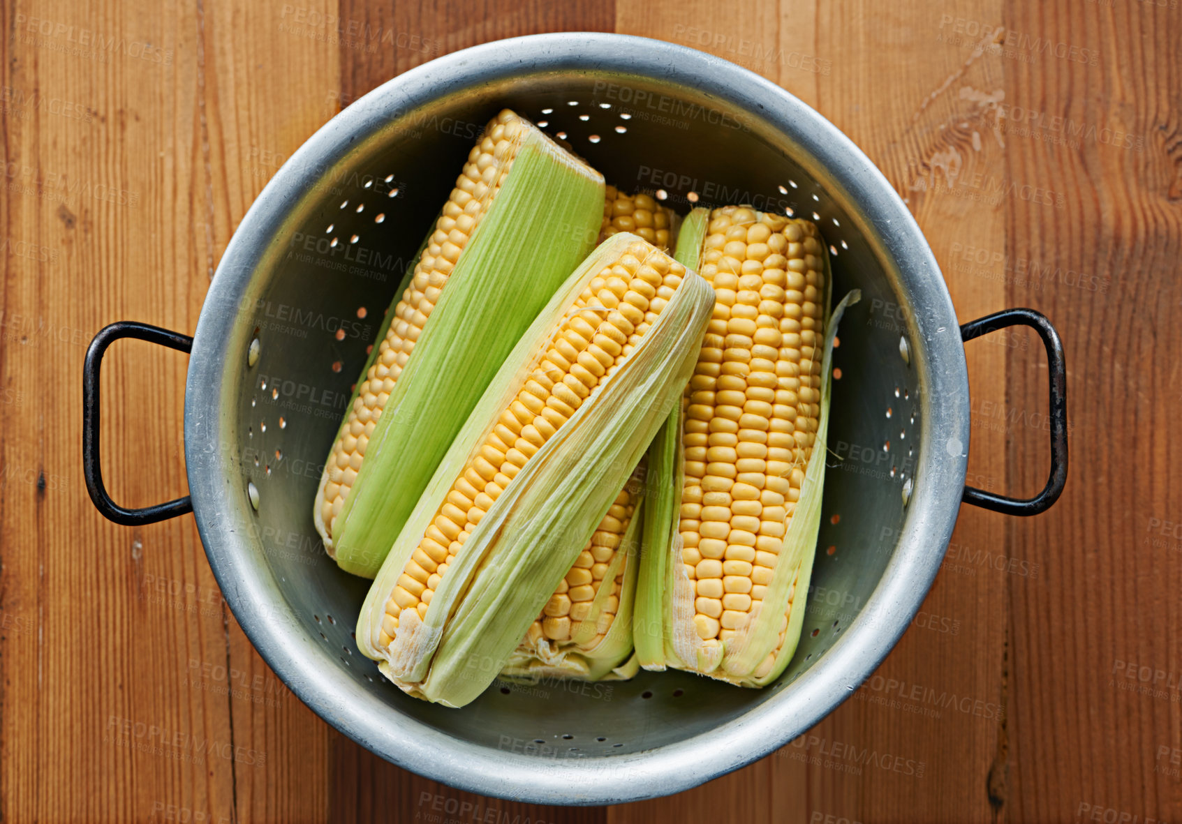 Buy stock photo Closeup, corn or maize on table for fruit, wellness or healthy nutrition in home meal or kitchen. Cobs, background or above of natural produce for raw organic food, fiber or vitamin b in lunch diet