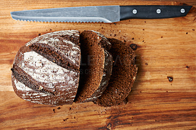 Buy stock photo Knife, bread or loaf on a bakery kitchen or table for healthy breakfast, lunch or food in restaurant. Closeup, background or fresh homemade bun for carbohydrates, fiber or vitamins in meal or diet