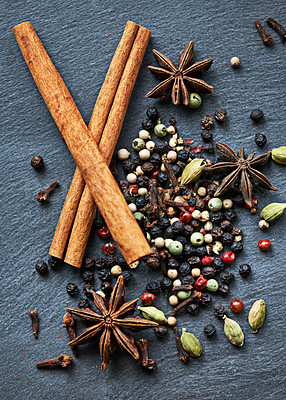 Buy stock photo Whole spices, collection of ingredients and cooking for food, fragrance and flavor with culinary background. Stick cinnamon, star anise and cardamom with peppercorns for catering, seasoning and aroma