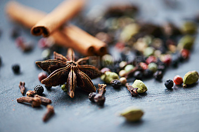 Buy stock photo Closeup of whole spices, mix of ingredients and cooking for food, fragrance and flavor with culinary background. Stick cinnamon, star anise and peppercorn for catering, seasoning collection and aroma