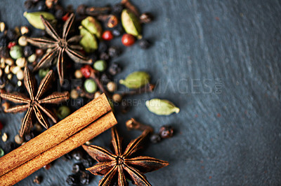 Buy stock photo Whole spices, ingredients and cooking for food with mockup, fragrance and flavor with culinary space. Stick cinnamon, star anise and peppercorn with cardamom mix for catering, seasoning and aroma