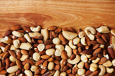 Buy stock photo Nuts, mix and organic snack for diet, health and variety of options for fat and minerals. Top view, nutrition and textures of vitamins or antioxidants, mockup space and cashew or almonds for energy