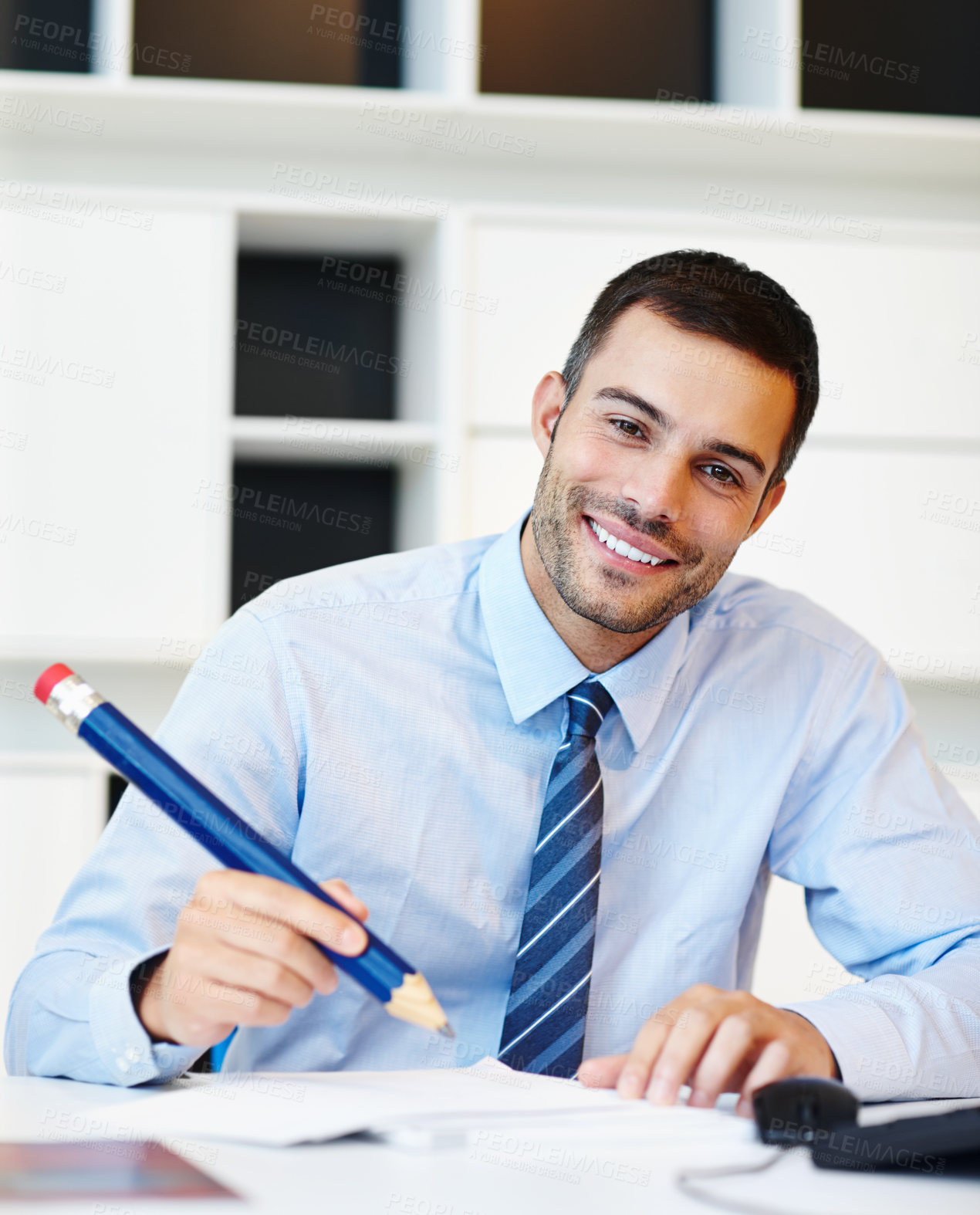 Buy stock photo Pencil, portrait and smile with business man at desk in office for planning, report or writing. Agenda, prop and schedule with happy employee in workplace to sign documents for administration