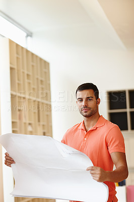 Buy stock photo Designer, architecture and man in portrait with floor plan or blueprint for office development and progress. Face of young person, contractor or worker with paper for property, planning or remodeling