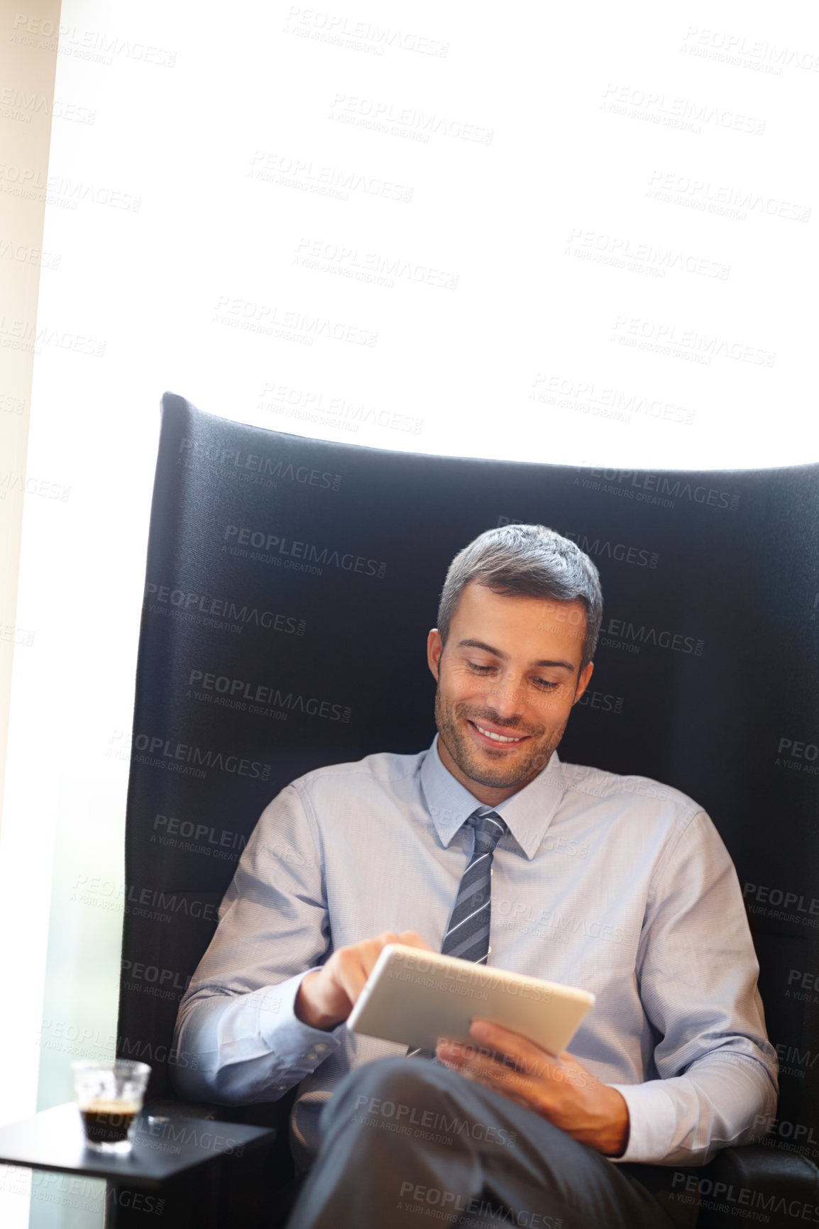 Buy stock photo Business, man and  happy in armchair with tablet, relax and office for stock market research for networking. Communication, information and smile for good news, online shares and virtual investor