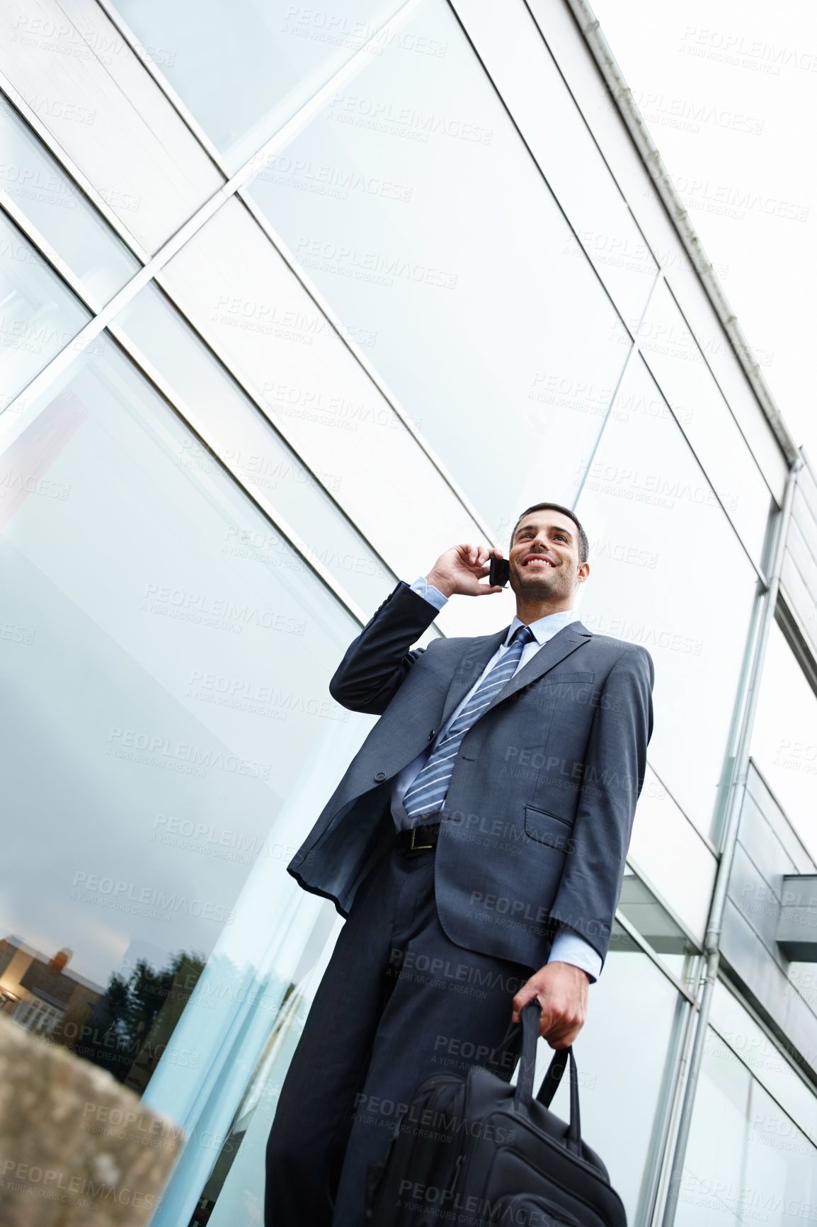 Buy stock photo Phone call, low angle or happy businessman by outdoor building talking for conversation or deal communication. News, proud banker and financial advisor networking for investment, negotiation or chat