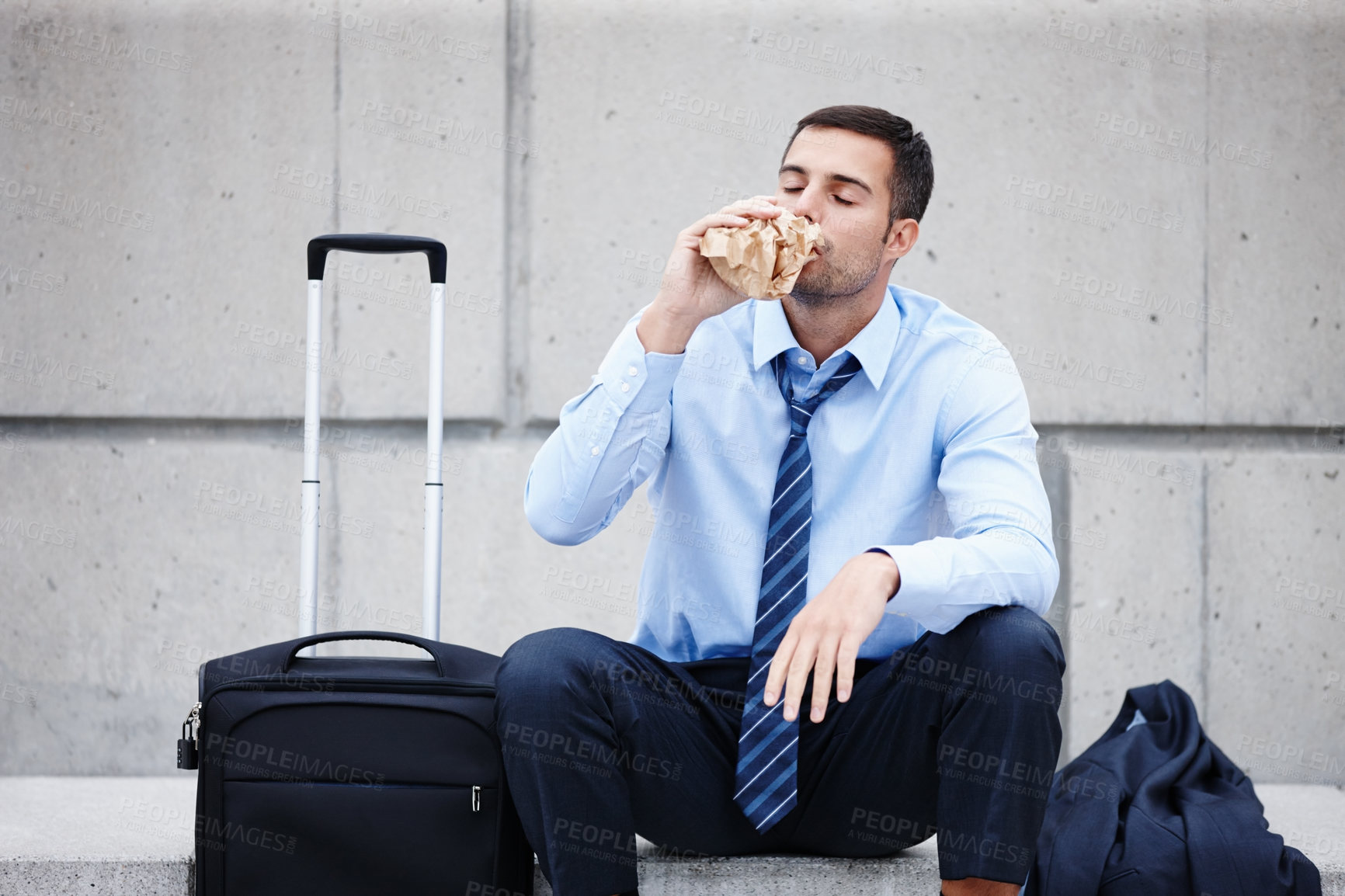 Buy stock photo Business, man and unemployed drunk with alcohol or wall background in city with luggage, travel or fired. Male person, drinking and mental health depression for job search fail, homeless or broke