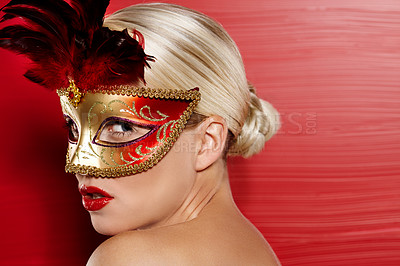 Buy stock photo Profile, beauty and woman in carnival mask for art deco, fantasy and dress up by red background. Confidence, female person and mysterious with pride for cosplay and mockup in studio with lipstick