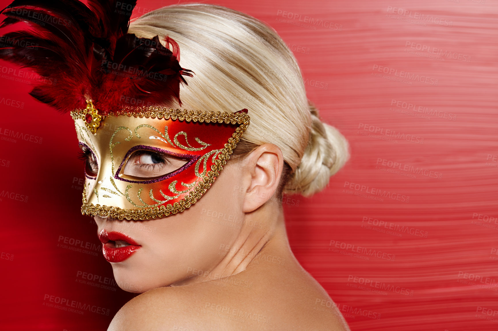 Buy stock photo Profile, beauty and woman in carnival mask for art deco, fantasy and dress up by red background. Confidence, female person and mysterious with pride for cosplay and mockup in studio with lipstick