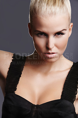 Buy stock photo Portrait of a seductive blonde woman with a black dress on