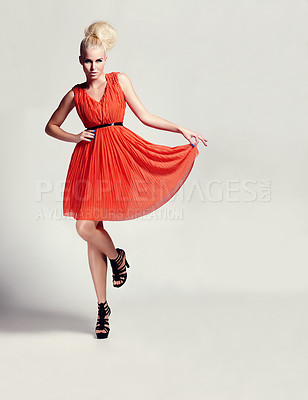 Buy stock photo Portrait of a confident model in a red flowing dress