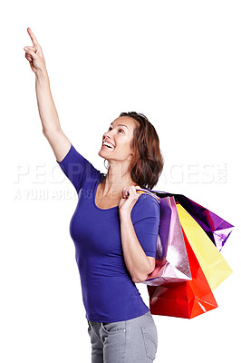 Buy stock photo Happy, woman and customer pointing with shopping bags in portrait for mockup, promotion or offer in studio. Marketing, female person and package for sale, deal or discount with white background