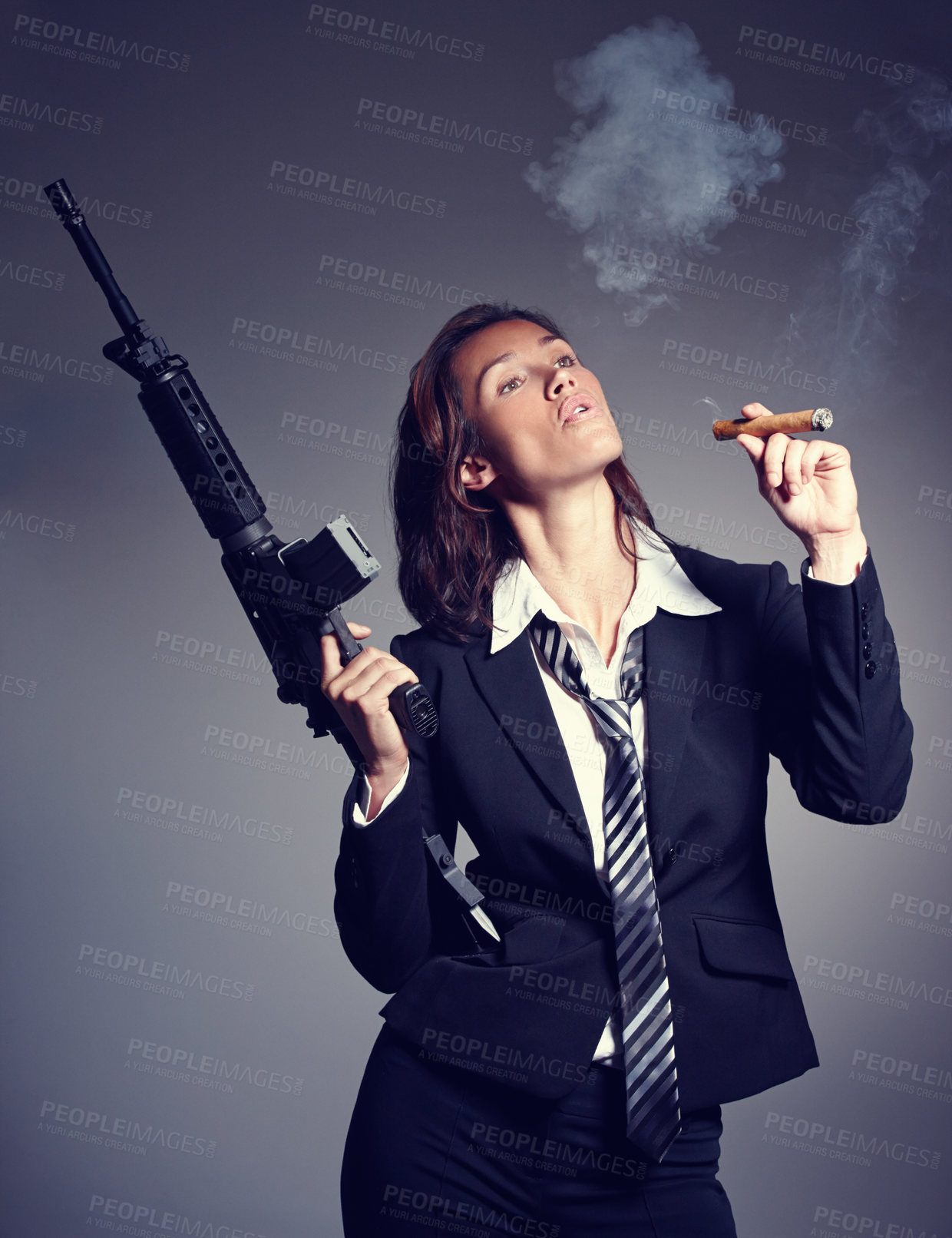 Buy stock photo Business woman, cigar and gun in suit on studio background for company threat, independence and danger. Female person, face and rifle as corporate criminal for crime, corruption or fraud in system