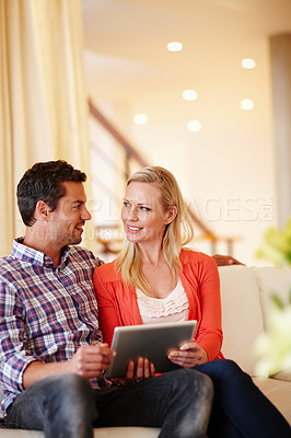 Buy stock photo Couple, tablet and smile with online investment, planning and email with internet banking and saving. Happy, home and people together with tech in living room on sofa with love, care and support  