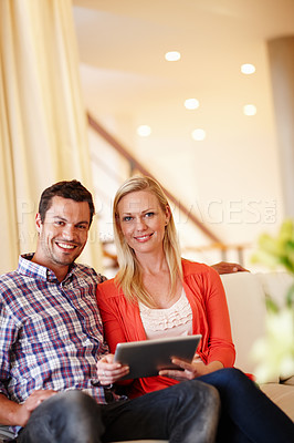 Buy stock photo Couple, tablet and couch for relax in home, portrait and smile in living room for online email. Technology, digital and internet booking app for vacation, sofa and man with female person in lounge