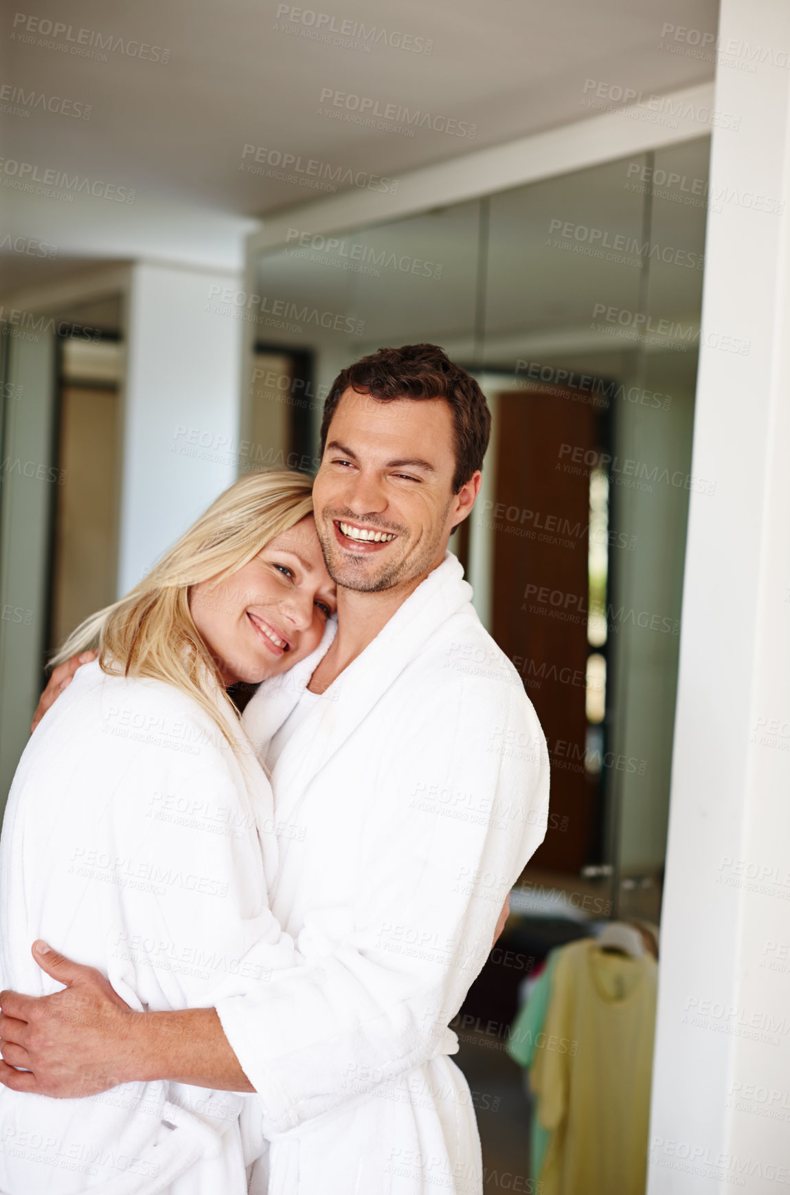 Buy stock photo Couple, people and happy for hug in spa, affection and love for commitment or holiday in hospitality hotel. Happiness, smile on wellness retreat for relax or relationship bond, together and partner