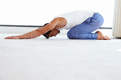 Buy stock photo Yoga, stretching and man on floor for spiritual fitness, wellness and workout in bedroom. Health, pilates session and male person with childs pose for mindfulness, balanced chi or healing in home