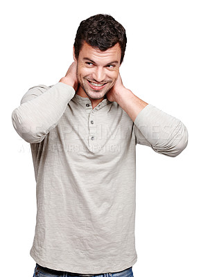 Buy stock photo Face, smile and shy man in studio isolated on a white background looking happy and shy. Thinking, cool and modern model male posing in casual clothes for trendy style and positive mindset or idea