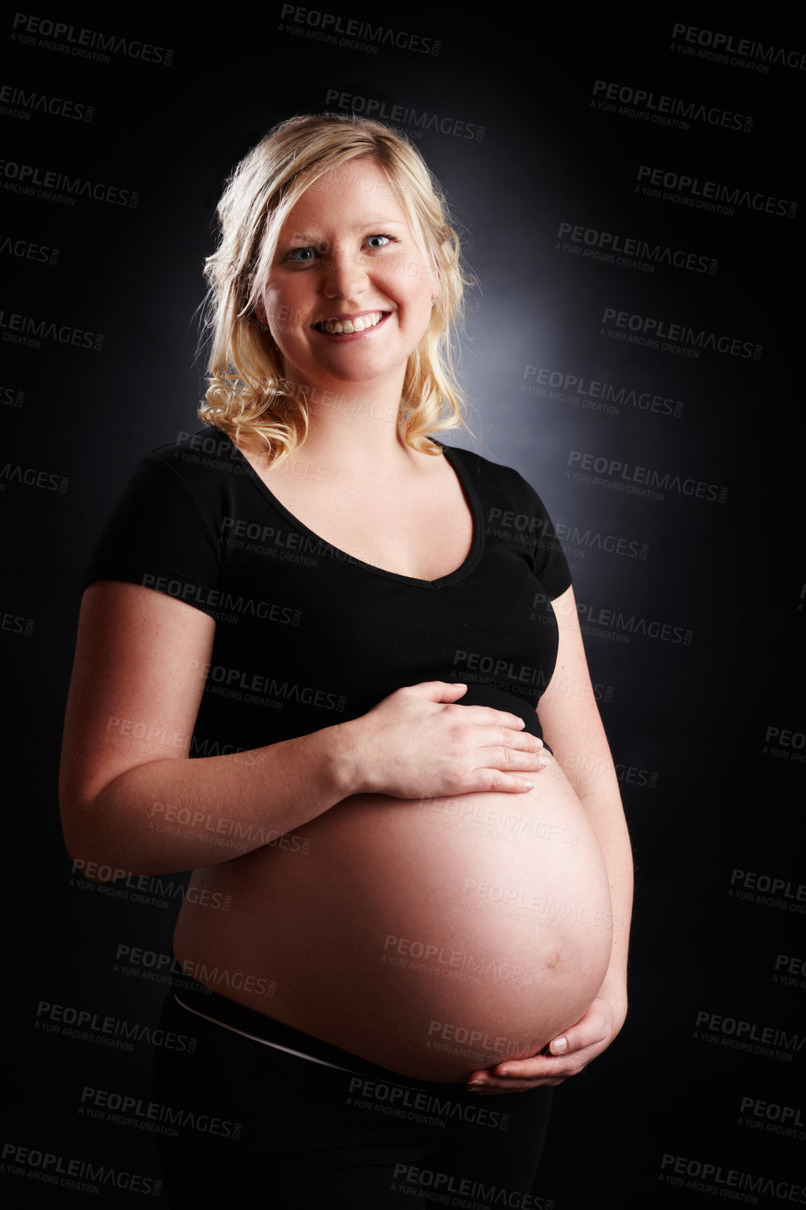 Buy stock photo Pregnant, woman and portrait with belly in studio, baby bump and expectant mother smile for pregnancy. Black background, gestation and gynecology or stomach growth, maternity and love for unborn kid