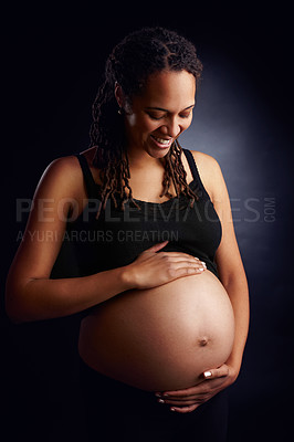 Buy stock photo Pregnant, mother and care with stomach in studio, baby bump and woman in pregnancy. Black background, gestation and gynecology for belly growth, maternity wellness and motherhood for family planning