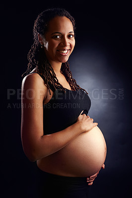 Buy stock photo Pregnant, woman and portrait with belly in studio, baby bump and expectant mother for pregnancy. Black background, gestation and gynecology wellness or family planning, maternity and stomach growth