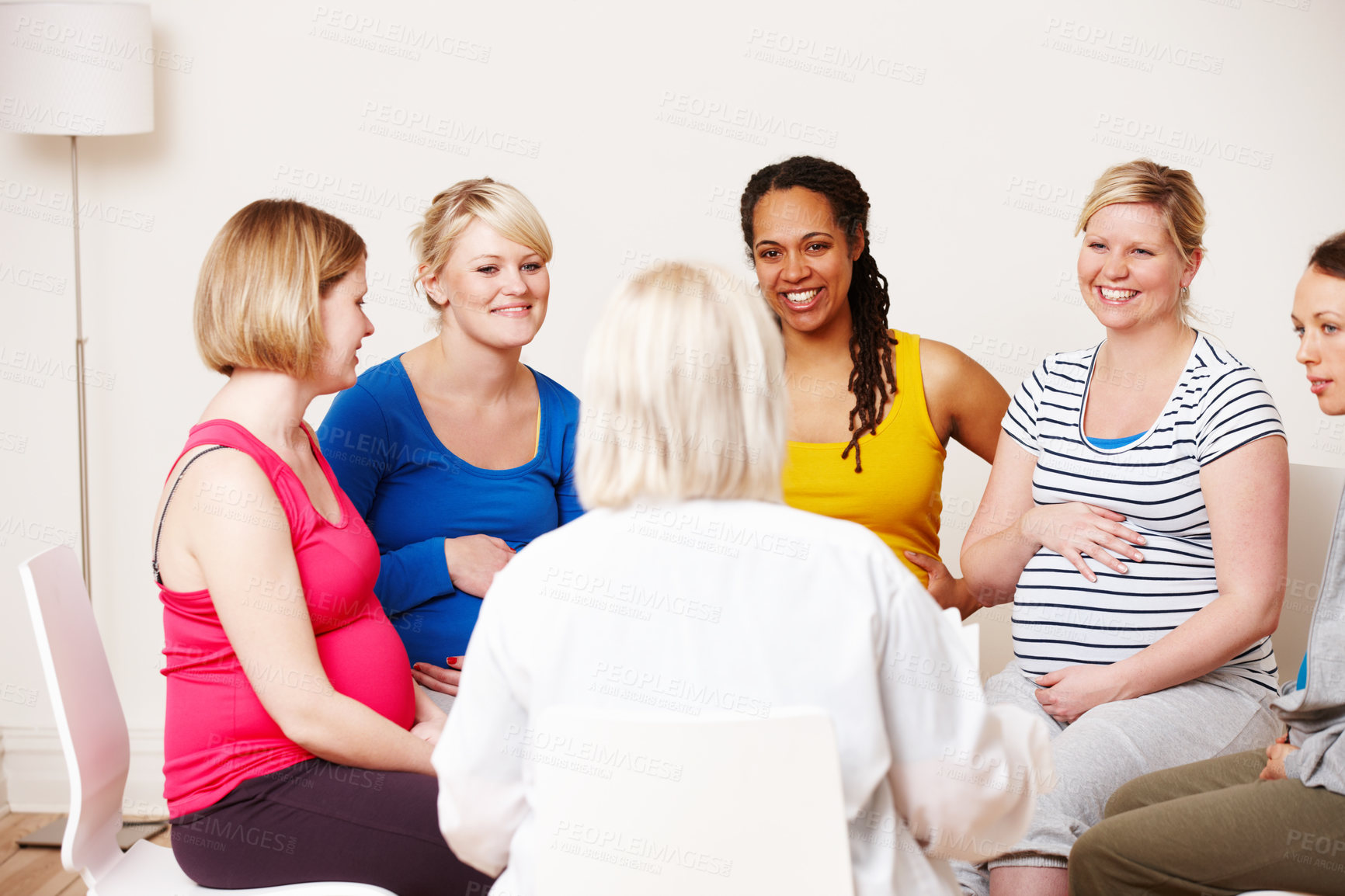 Buy stock photo Checkup, women and happy with gynecologist in support group for consultation and health. Pregnancy, people an maternity with smile or satisfied for healthcare with trust, care and conversation