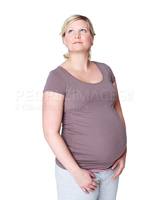 Buy stock photo Thinking, pregnant and woman in studio for baby wellness, parenthood or daydreaming with white background. Stomach, thoughtful and future mother with planning for prenatal care, birth or fetus health