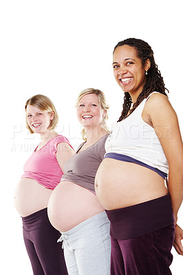 Buy stock photo Portrait, women and pregnant in studio for support, wellness and care or love with diversity. Community, friends and happy mothers by white background for development, health and growth for children