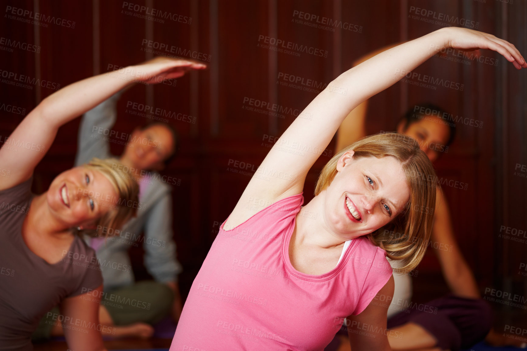 Buy stock photo Woman, portrait and yoga class for stretching, wellness and mental health with balance, happiness and smile. People, face and mindfulness in studio for fitness, energy and body awareness with pilates